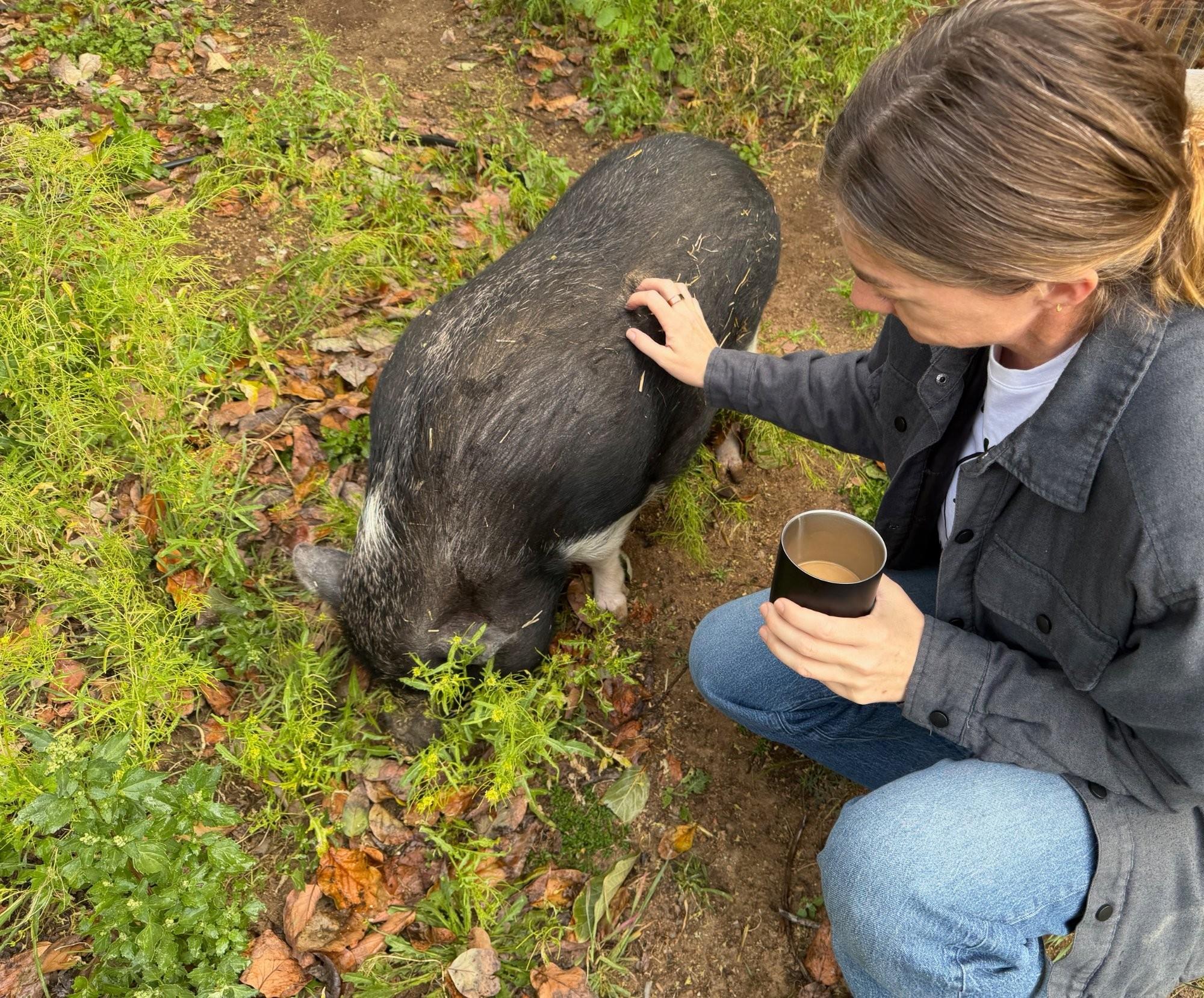 Sands with one of the sanctuary’s resident pigs at Zephyr Mountain Farm Sanctuary, Wildomar, California.