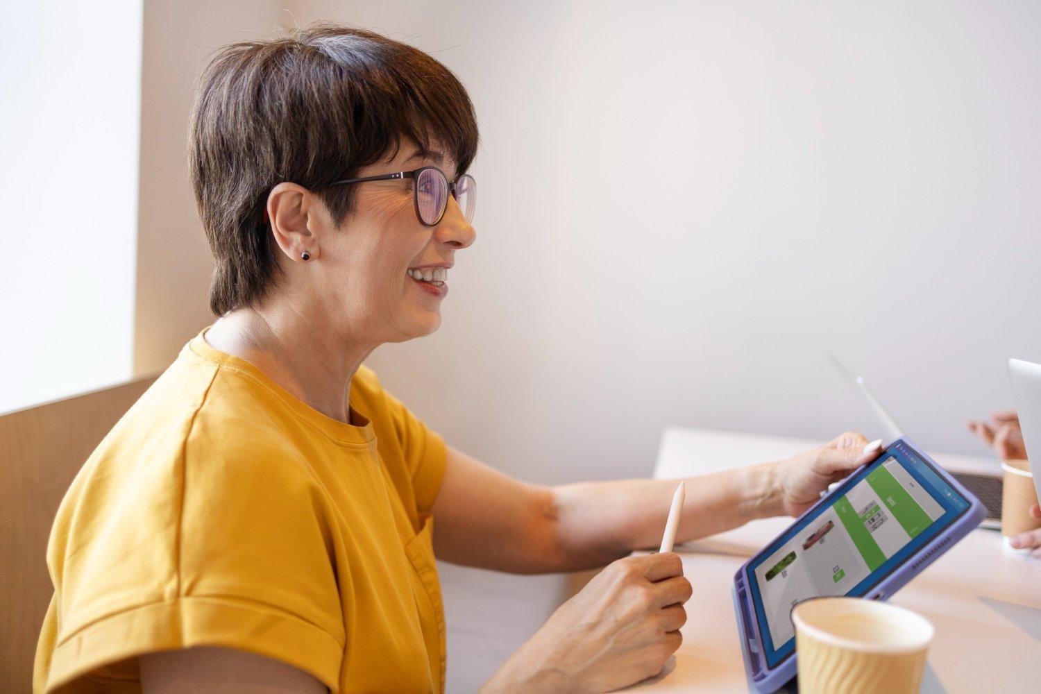 A clinician reviews scheduling and clinical data on a tablet. ABA’s authorization-driven scheduling, session-to-claim conversion, and real-time graphing requirements make it one of the most difficult healthcare specialties to digitize effectively. | Photo: Stock