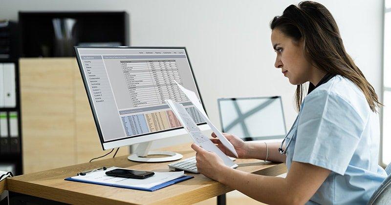 A healthcare administrator reviews claims