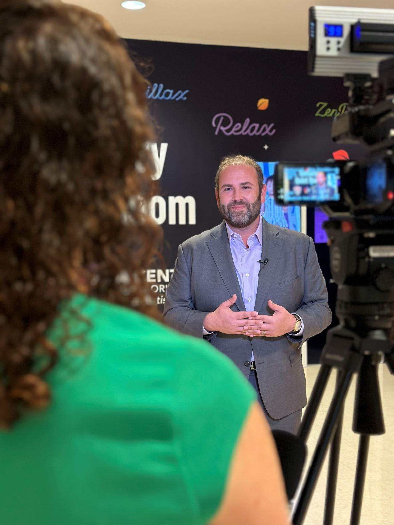 Barnett being interviewed on camera at an ABA Centers event