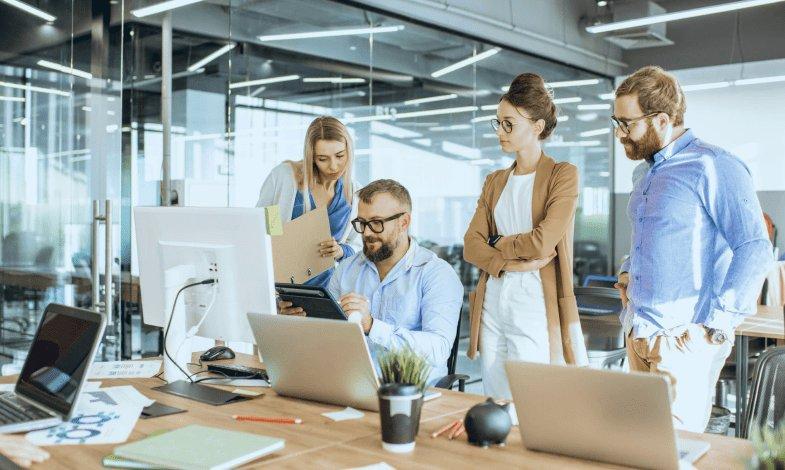 A technology team collaborates on product development. CurativeAI’s CEO Luyuan Fang previously served as Chief AI Officer at Change Healthcare, where his AI platforms processed 50 percent of all U.S. healthcare claims before the company was acquired by Optum/UnitedHealthcare for $13.5 billion. | Photo: stock