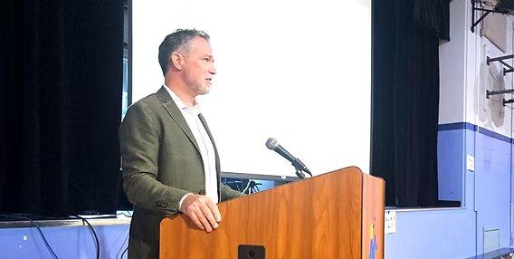 Dr. Hanley addresses an audience at a keynote presentation