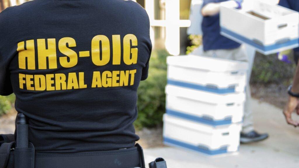 An HHS-OIG federal agent at a Medicaid fraud enforcement action. The OIG has audited ABA programs in four states and found improper or potentially improper claims in every single sampled enrollee-month.