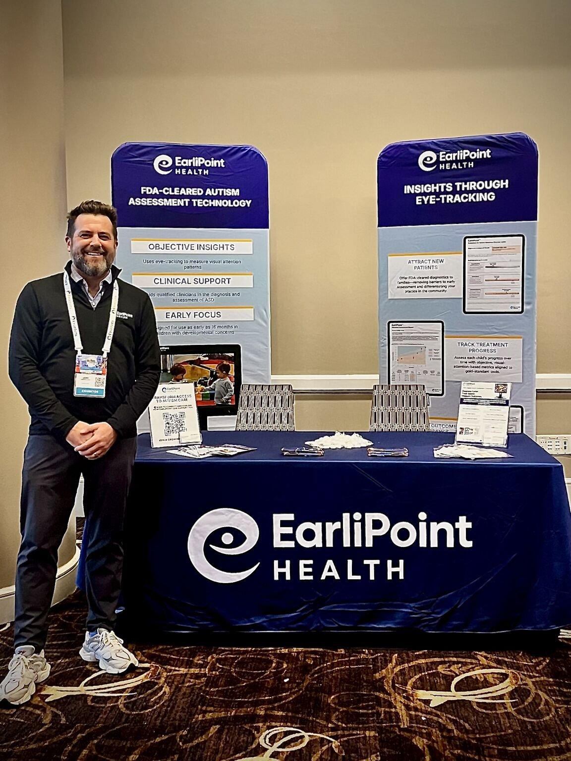 Pagliaro at the EarliPoint Health exhibit booth