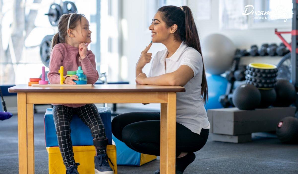 A therapist works one-on-one with a child during an ABA therapy session