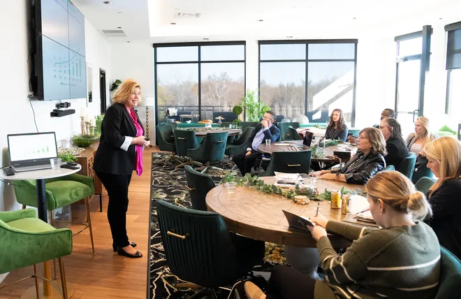 A KidsChoice leadership session. The company enters its PE-backed chapter with an organizational structure that pairs a BCBA-trained CEO with two co-presidents split across business operations and clinical growth.