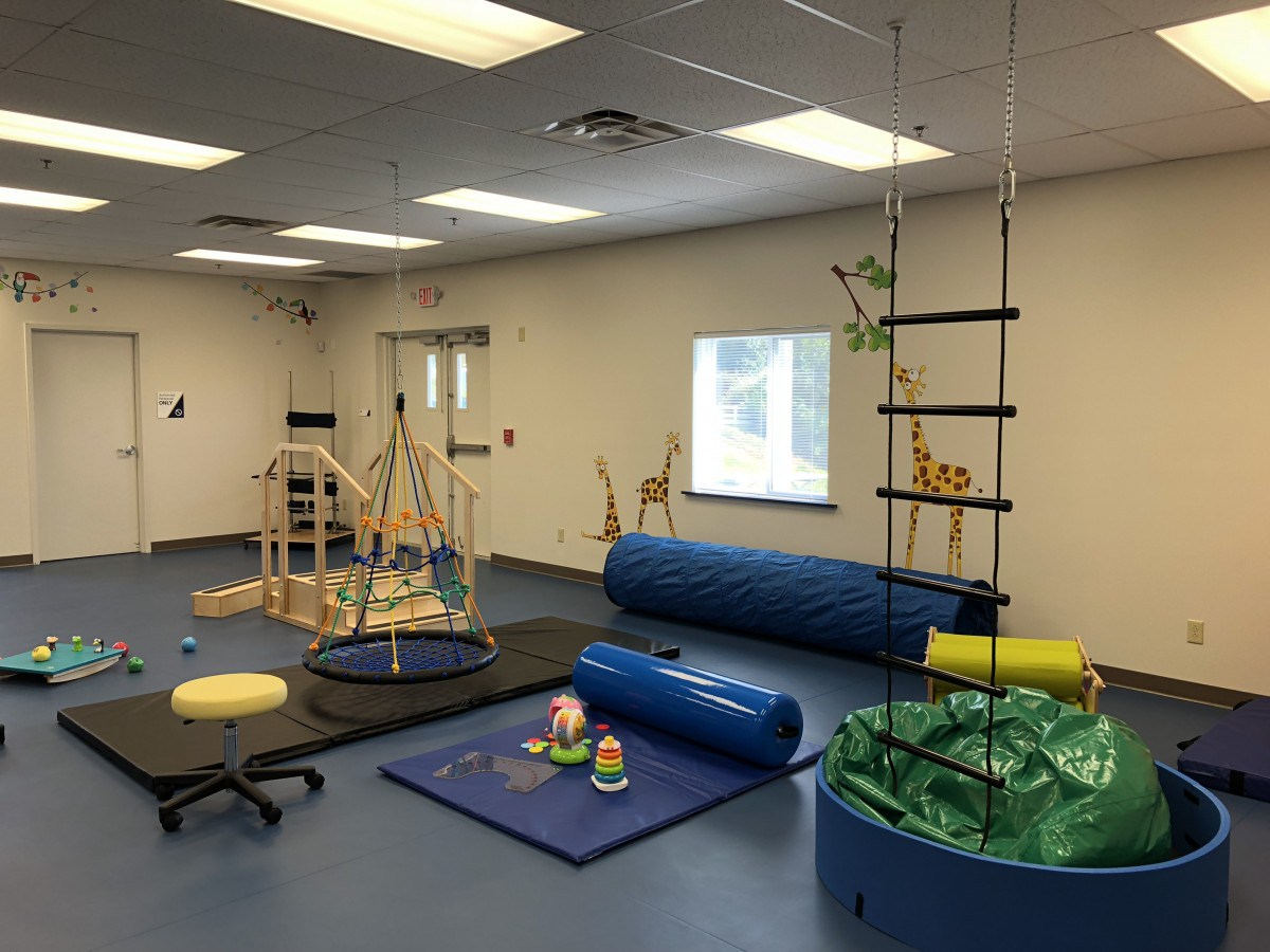 Inside a West Virginia pediatric therapy clinic. The coalition's workforce pipeline starts with Registered Behavior Technicians, who deliver direct one-to-one therapy in spaces like this.